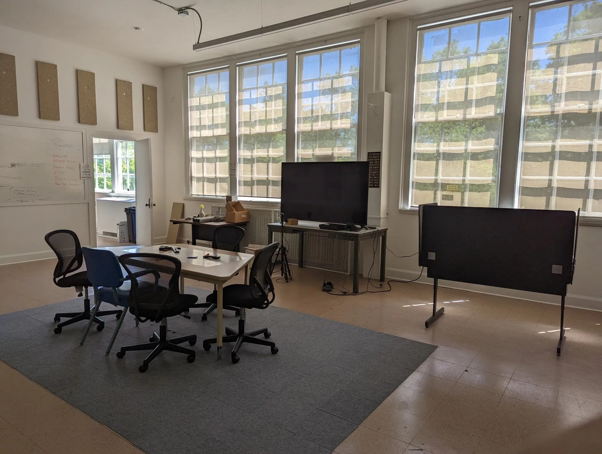 BRIC coworking area with table and television for presentations or conferencing
