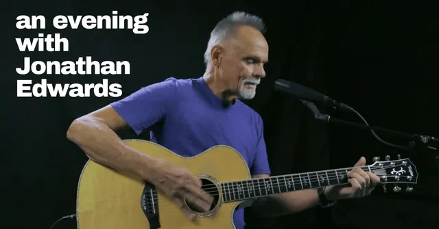 Jonathan Edwards playing guitar for the BRIC concert events
